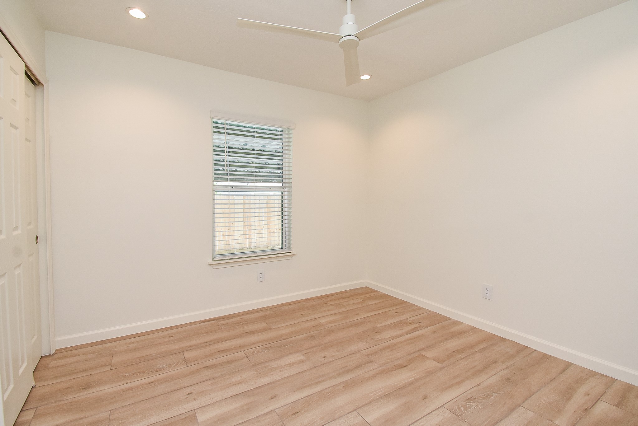 2509 Terry Street, Unit A Houston, TX 77009 - Photo 19 of 22 wooden floor in an empty room with a window