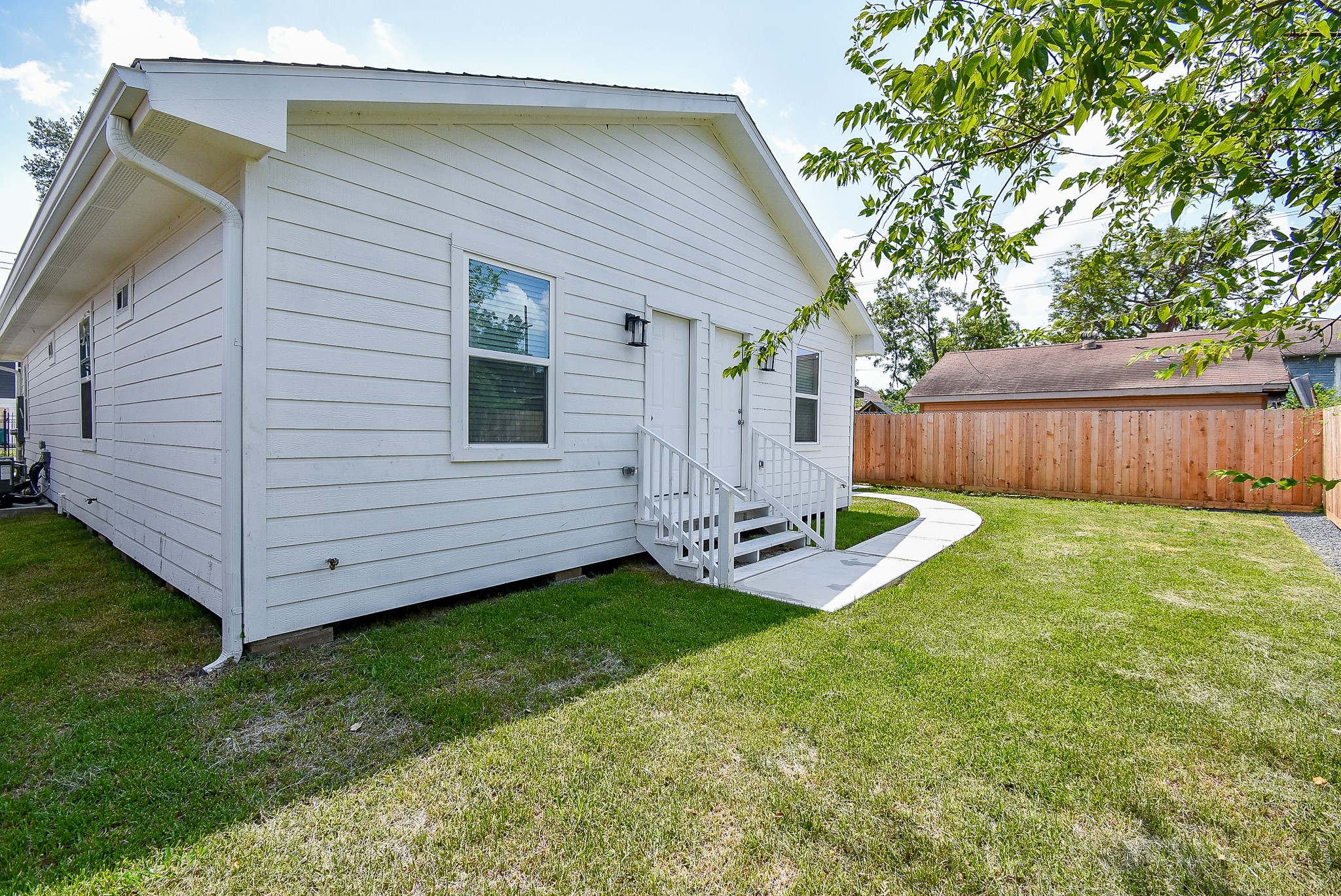 2509 Terry Street, Unit A Houston, TX 77009 - Photo 10 of 22 a view of a backyard with plants and large tree