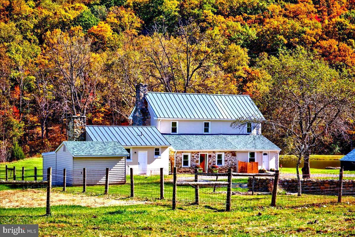 290 Riley Hollow Road Huntly, VA 22640 - Photo 136 of 148 a view of a house with a yard porch and sitting area