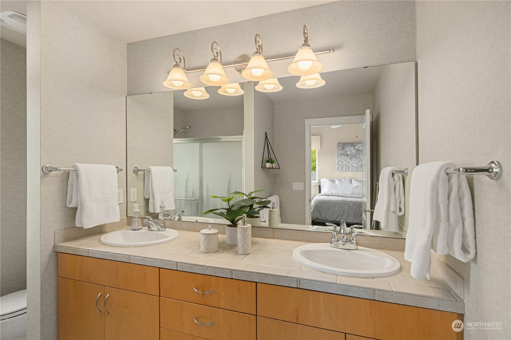 145 Sky Ridge Road Northwest Issaquah, WA 98027 - Photo 21 of 36 a bathroom with a sink vanity and a mirror