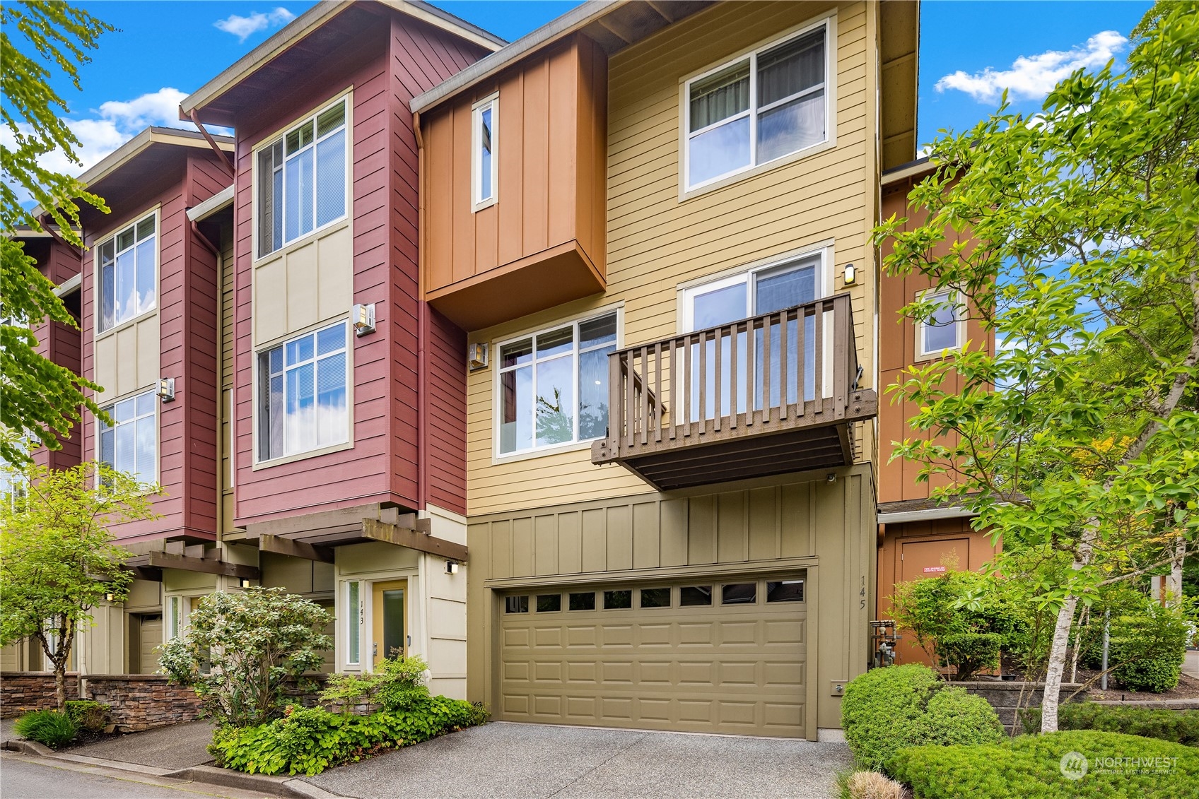 145 Sky Ridge Road Northwest Issaquah, WA 98027 - Photo 3 of 36 a view of a house with a garage and balcony