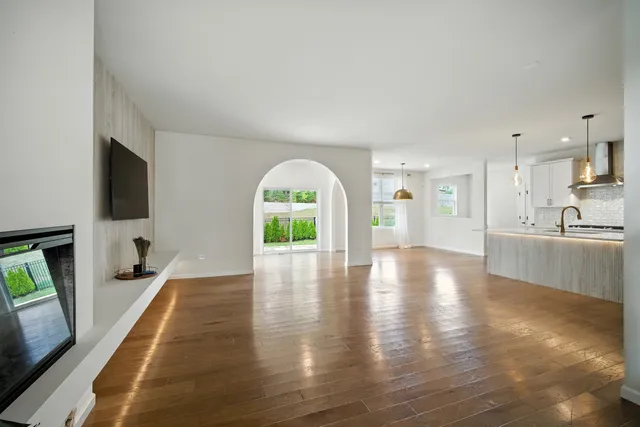 a view of a kitchen with a sink and a fireplace
