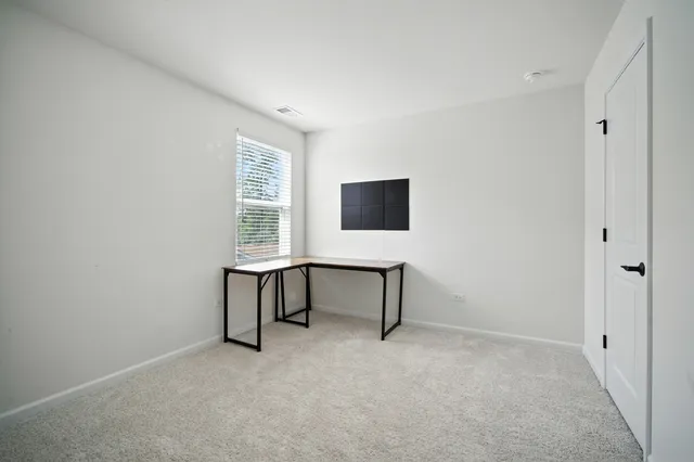 a view of a workspace with furniture