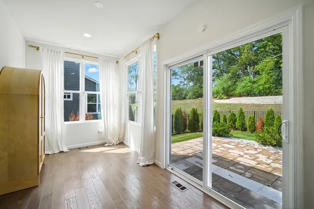 a view of a room with wooden floor and balcony