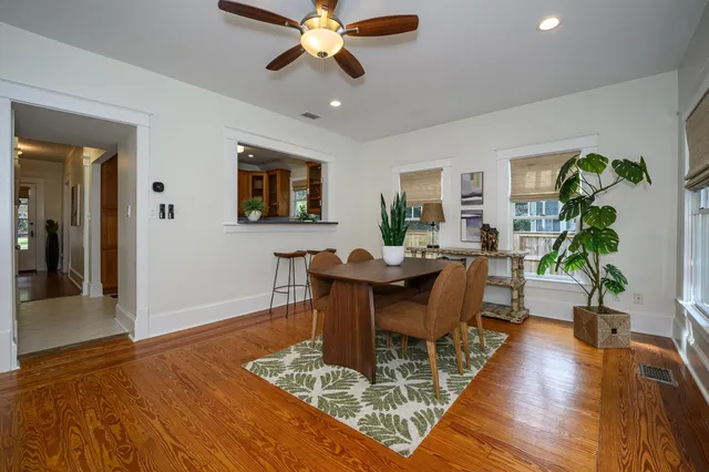 a view of a chair and table in backyard of the house