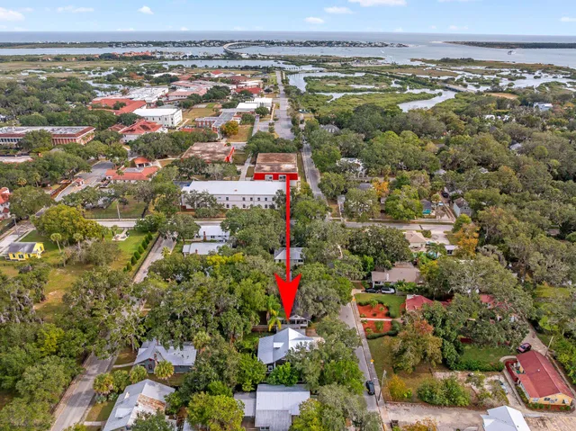 a balcony with furniture and a potted plant