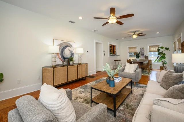 a spacious bathroom with a shower sink and mirror