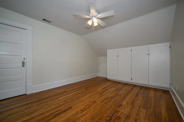 a living room with furniture a rug and a chandelier