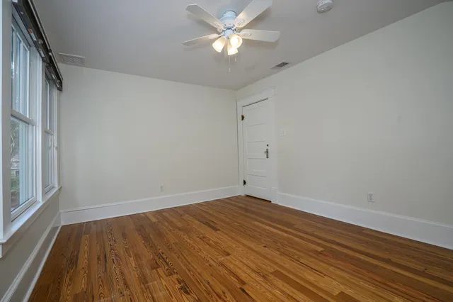 a view of a house with backyard and porch