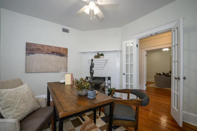 a living room with furniture potted plant and a window