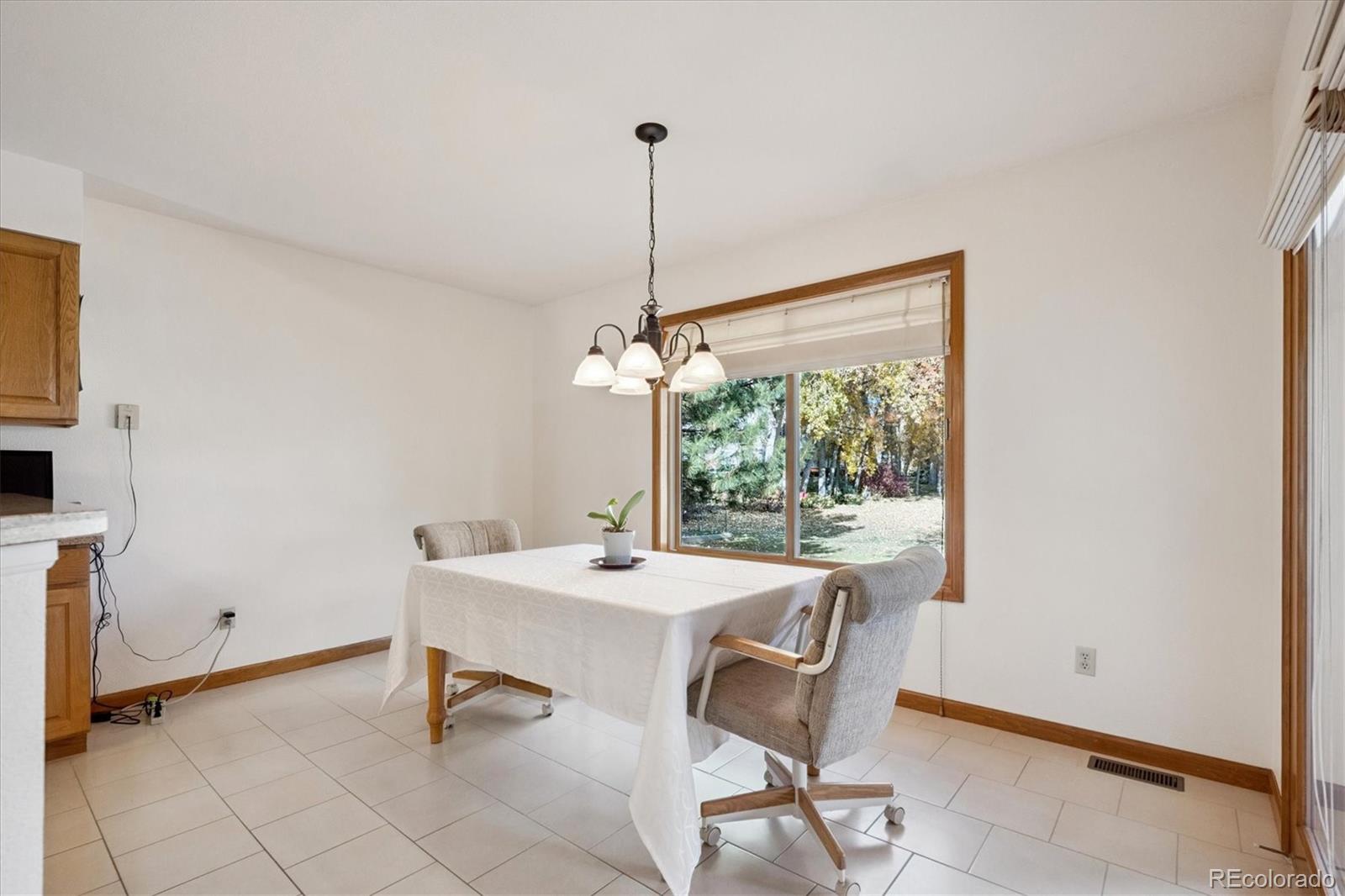 17537 59th Place Golden, CO 80403 - Photo 15 of 45 a dining room with furniture and window