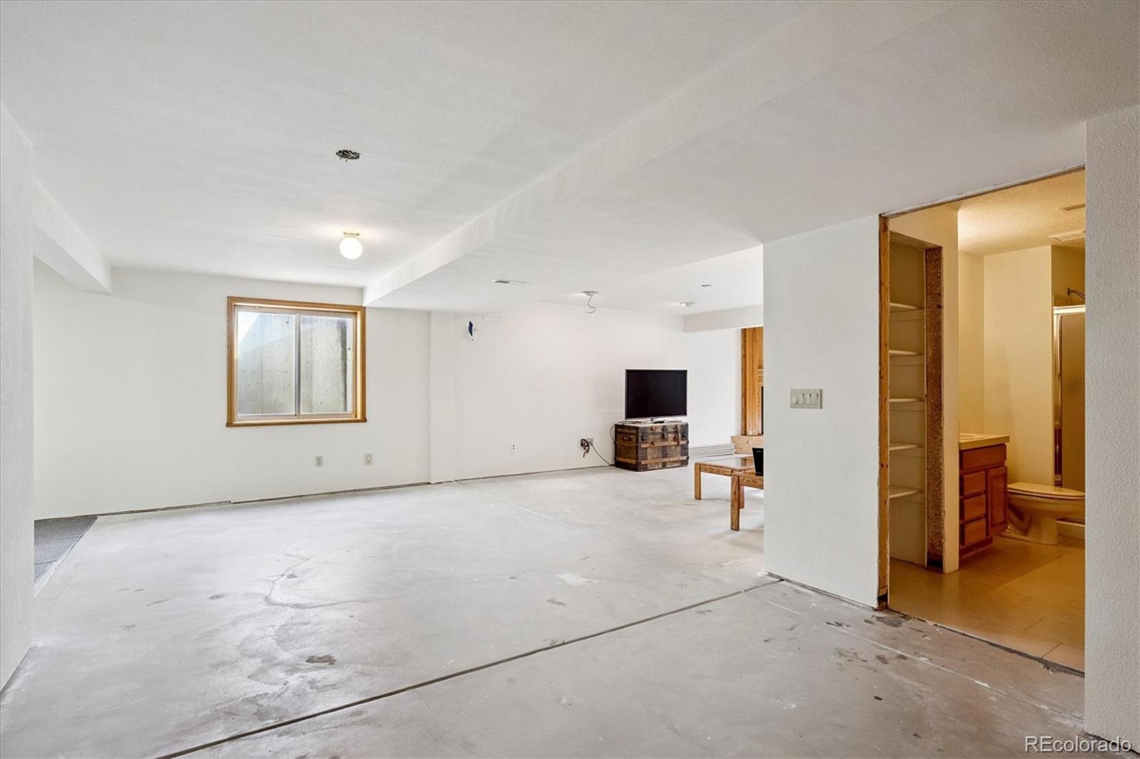 17537 59th Place Golden, CO 80403 - Photo 26 of 45 a view of livingroom with furniture and windows