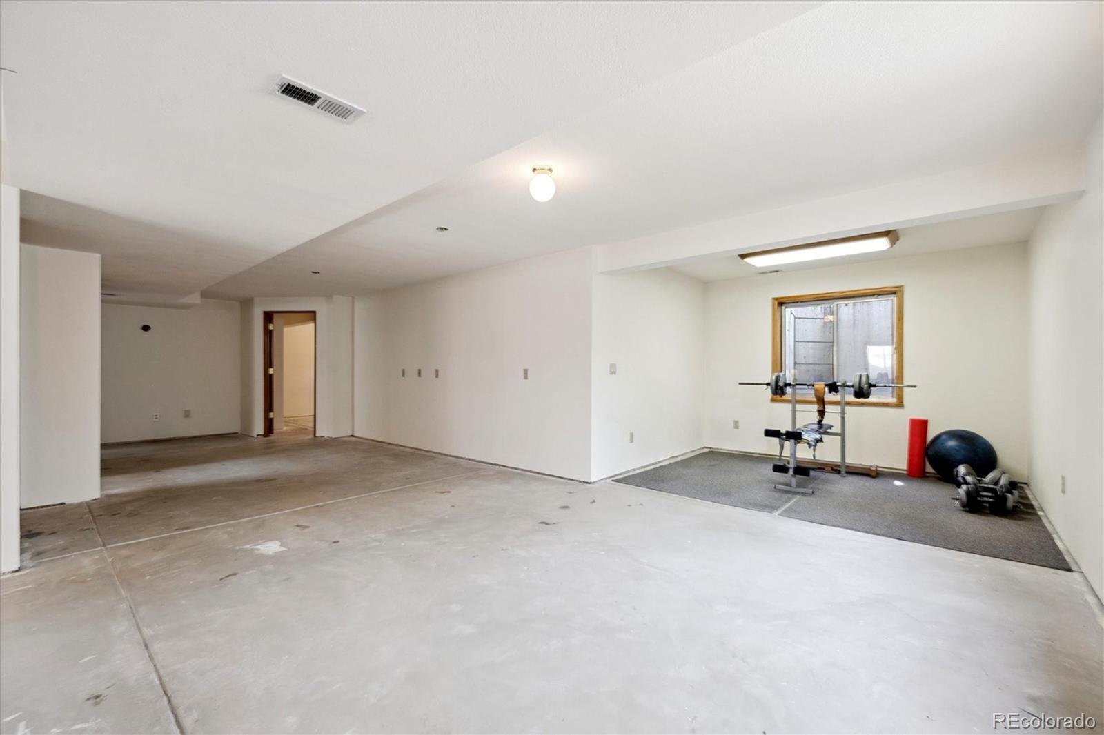 17537 59th Place Golden, CO 80403 - Photo 28 of 45 a view of a room with gym equipment