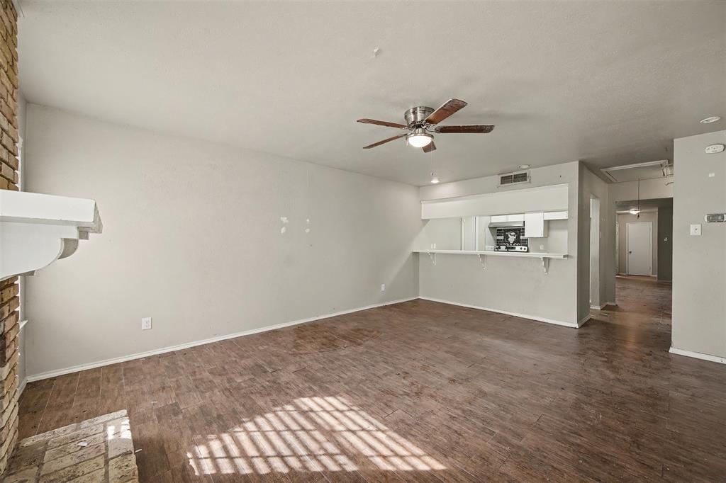 2302 18th Street Plano, TX 75074 - Photo 13 of 31 a view of an empty room with a kitchen