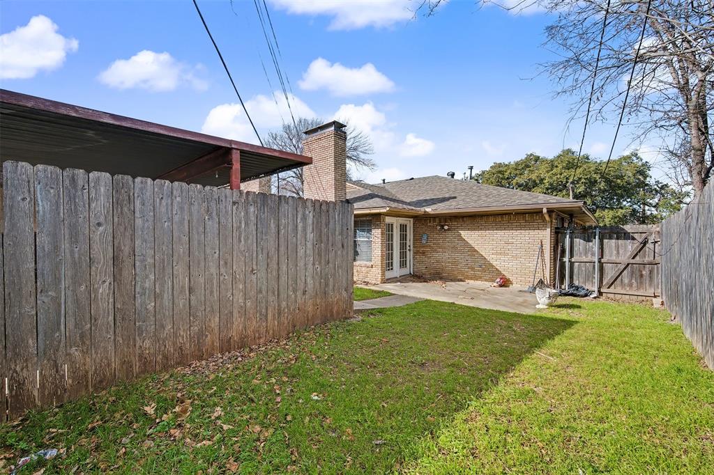 2302 18th Street Plano, TX 75074 - Photo 22 of 31 a view of a backyard with a garden