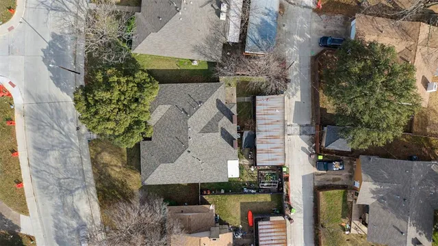 an aerial view of houses with an outdoor space