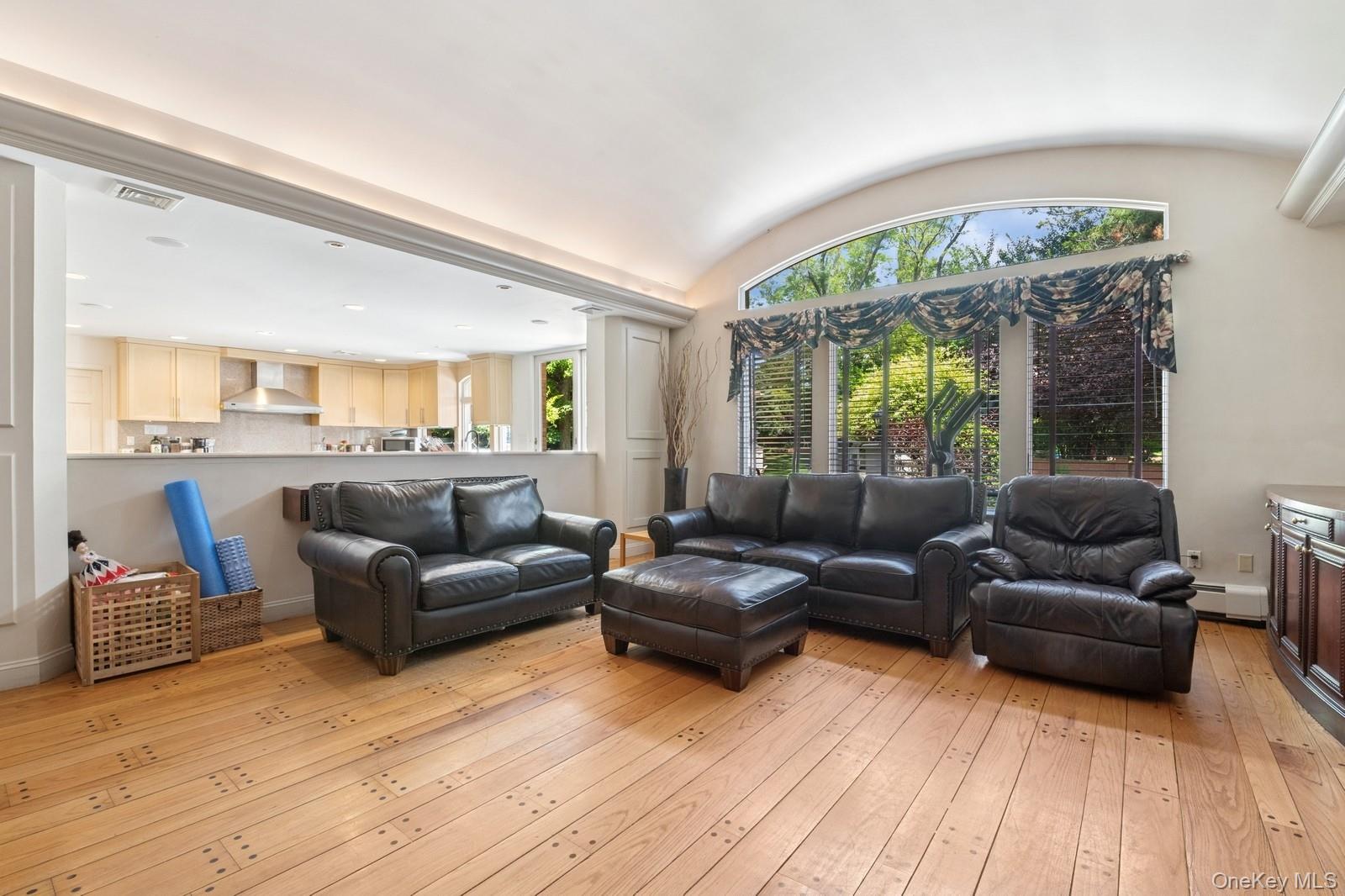 328 Ivy Hill Road Woodmere, NY 11598 - Photo 16 of 37 a living room with furniture and a large window