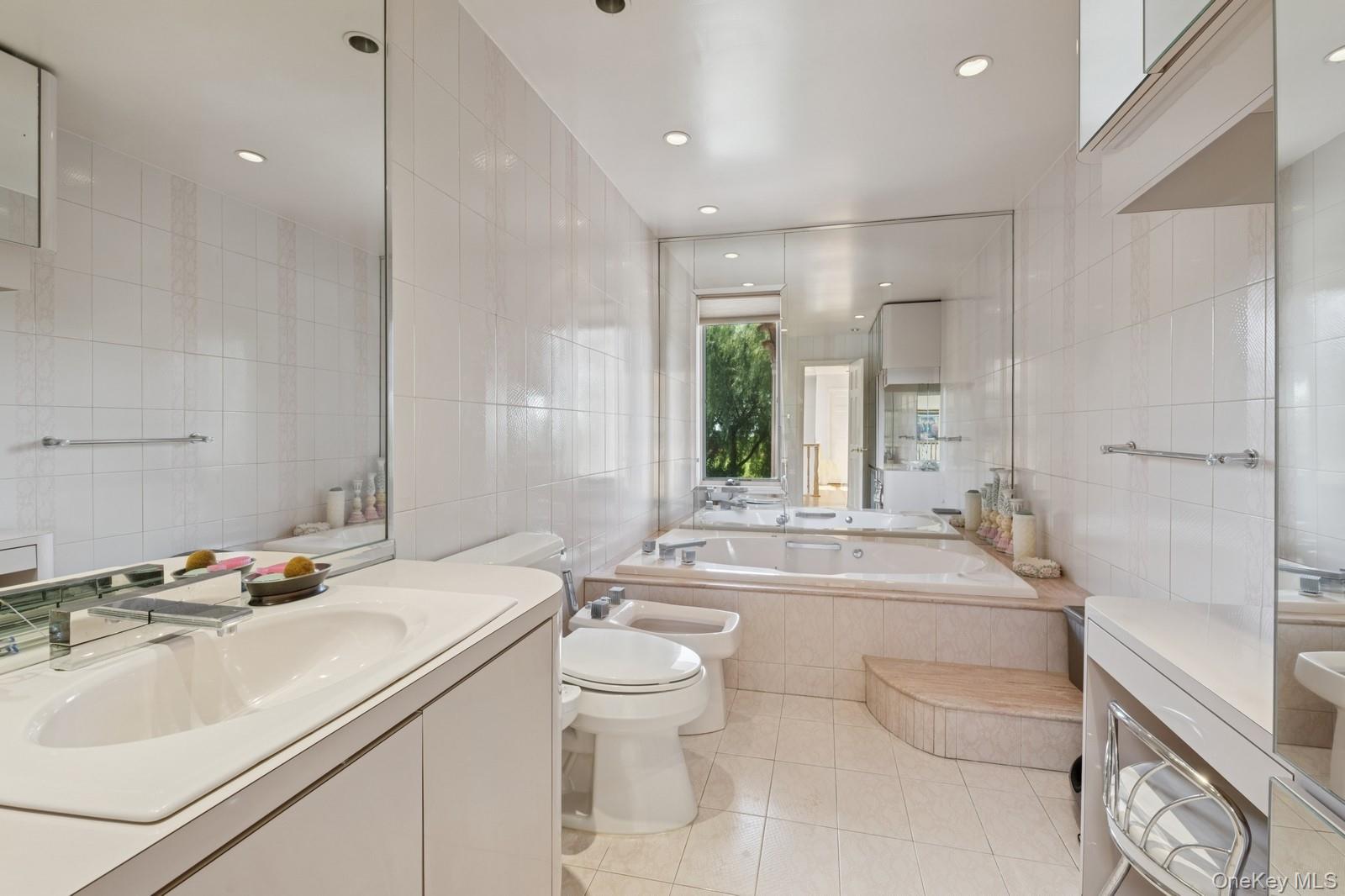 328 Ivy Hill Road Woodmere, NY 11598 - Photo 24 of 37 a bathroom with a double vanity sink toilet and shower