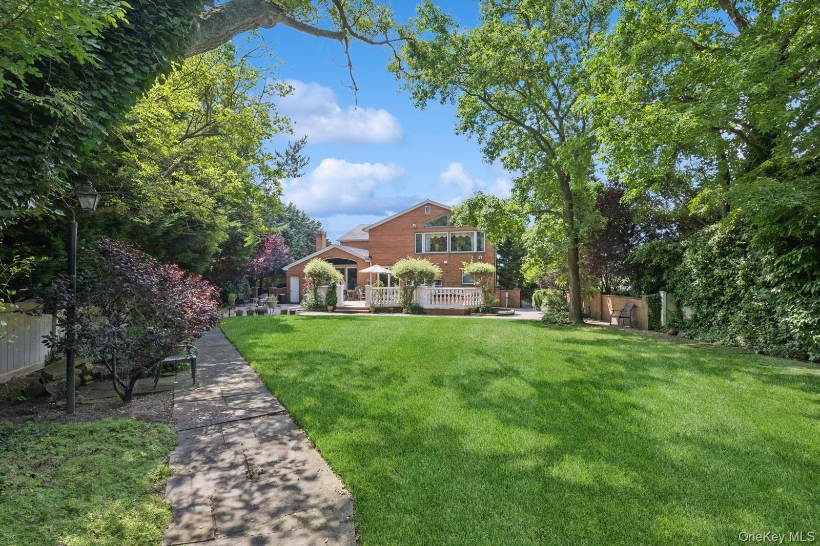 328 Ivy Hill Road Woodmere, NY 11598 - Photo 3 of 37 a view of a park with large trees