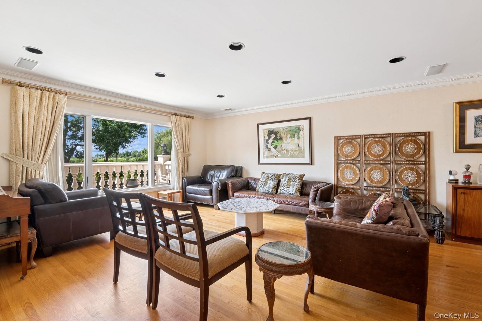 328 Ivy Hill Road Woodmere, NY 11598 - Photo 10 of 37 a living room with furniture and a large window
