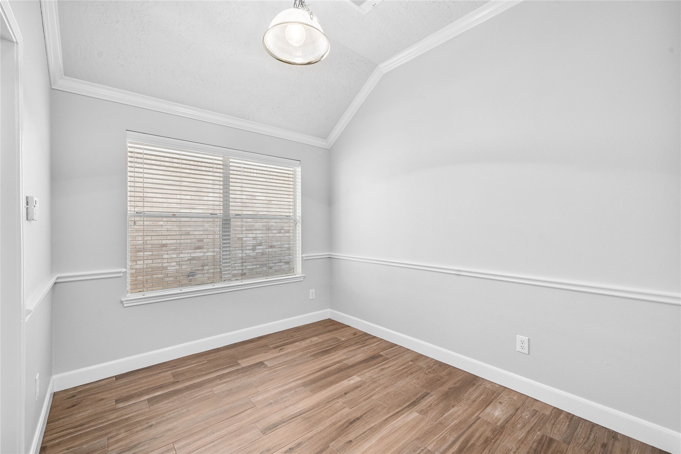 3623 Sage Pointe Court Katy, TX 77449 - Photo 13 of 32 an empty room with wooden floor and windows