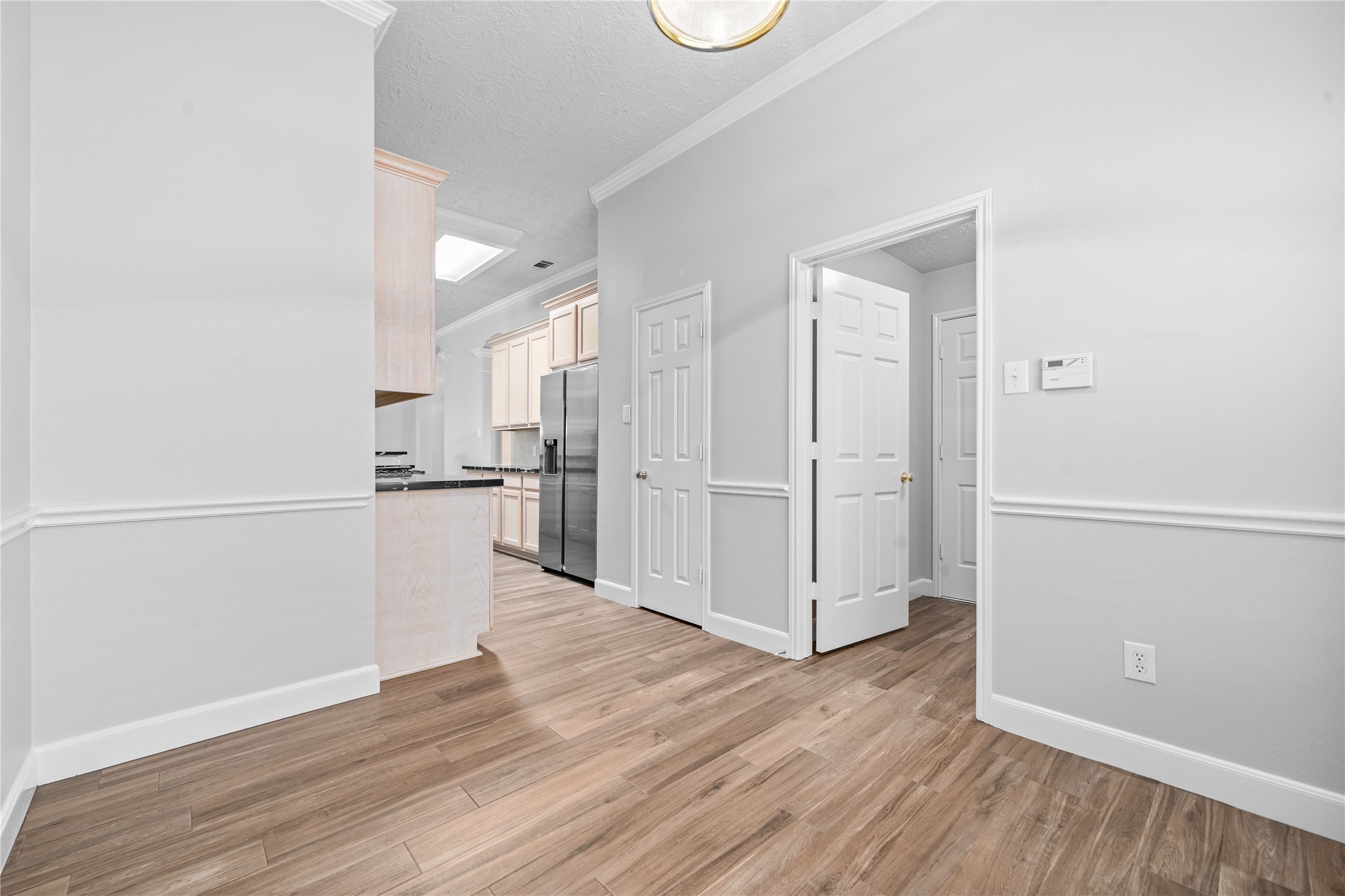 3623 Sage Pointe Court Katy, TX 77449 - Photo 14 of 32 a view of a kitchen with wooden floor and electronic appliances