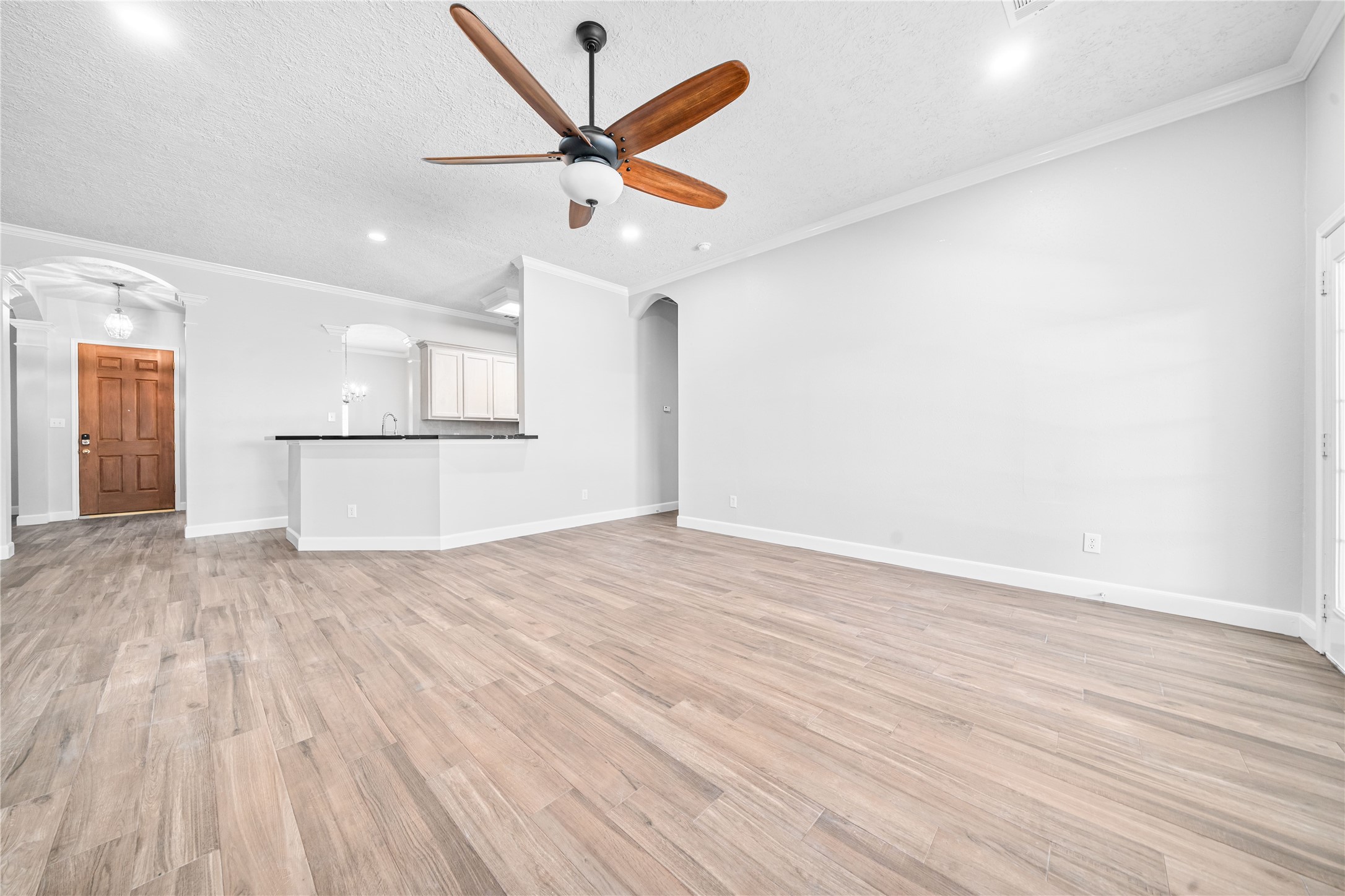 3623 Sage Pointe Court Katy, TX 77449 - Photo 17 of 32 a view of a kitchen with a dishwasher and wooden floor