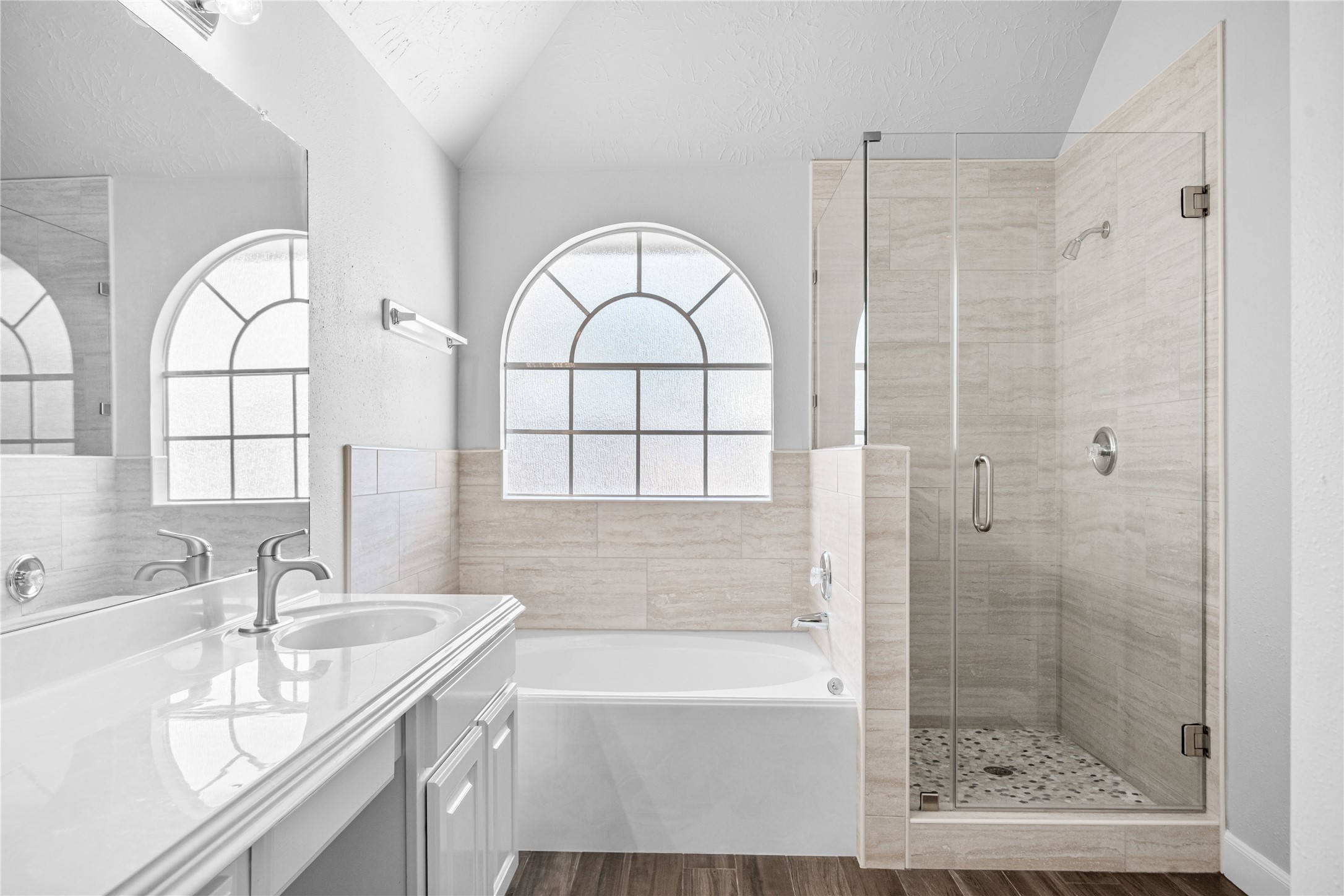 3623 Sage Pointe Court Katy, TX 77449 - Photo 24 of 32 a bathroom with a granite countertop sink a mirror and a bathtub