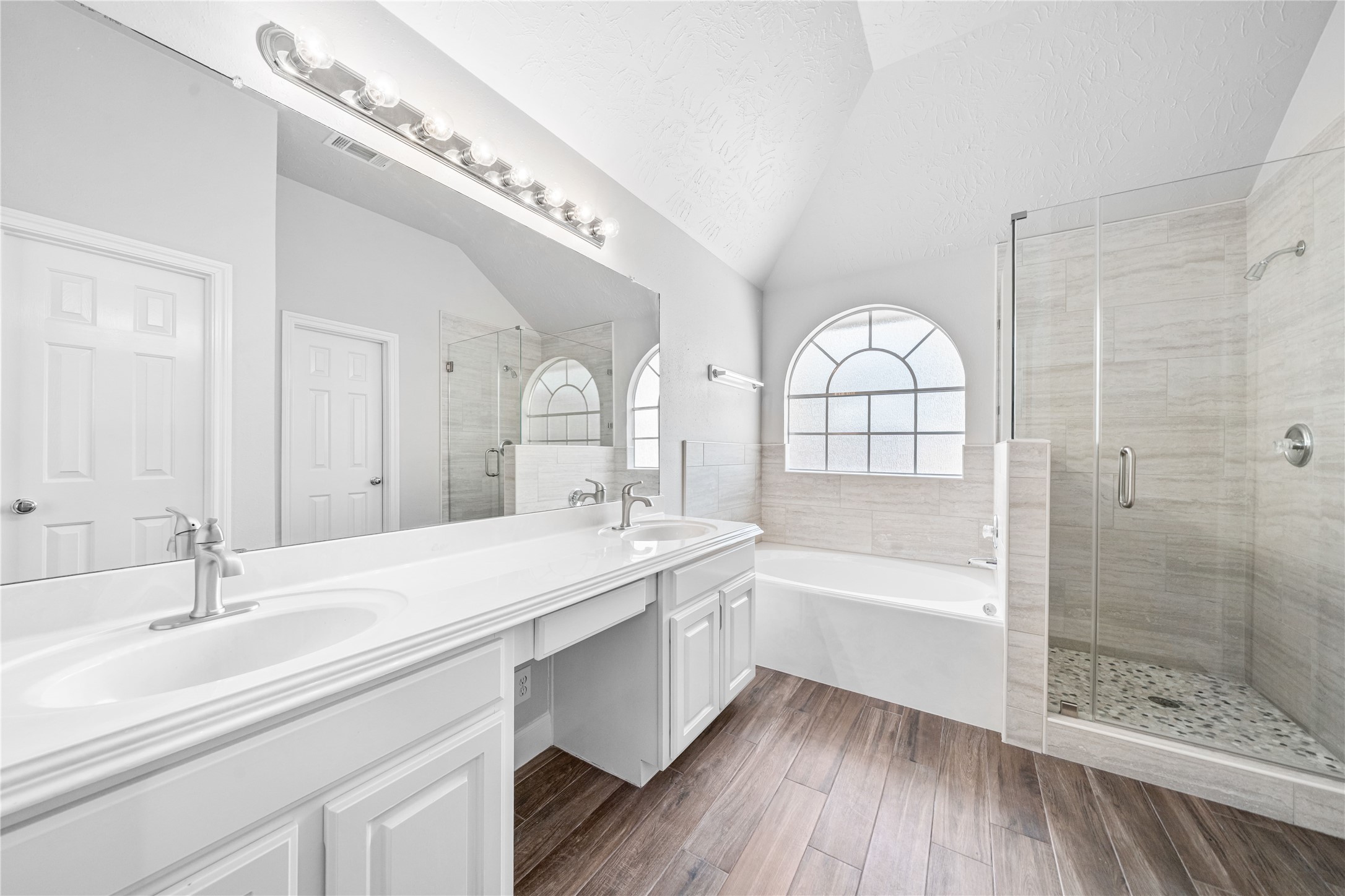 3623 Sage Pointe Court Katy, TX 77449 - Photo 25 of 32 a spacious bathroom with a bathtub a sink and a large mirror