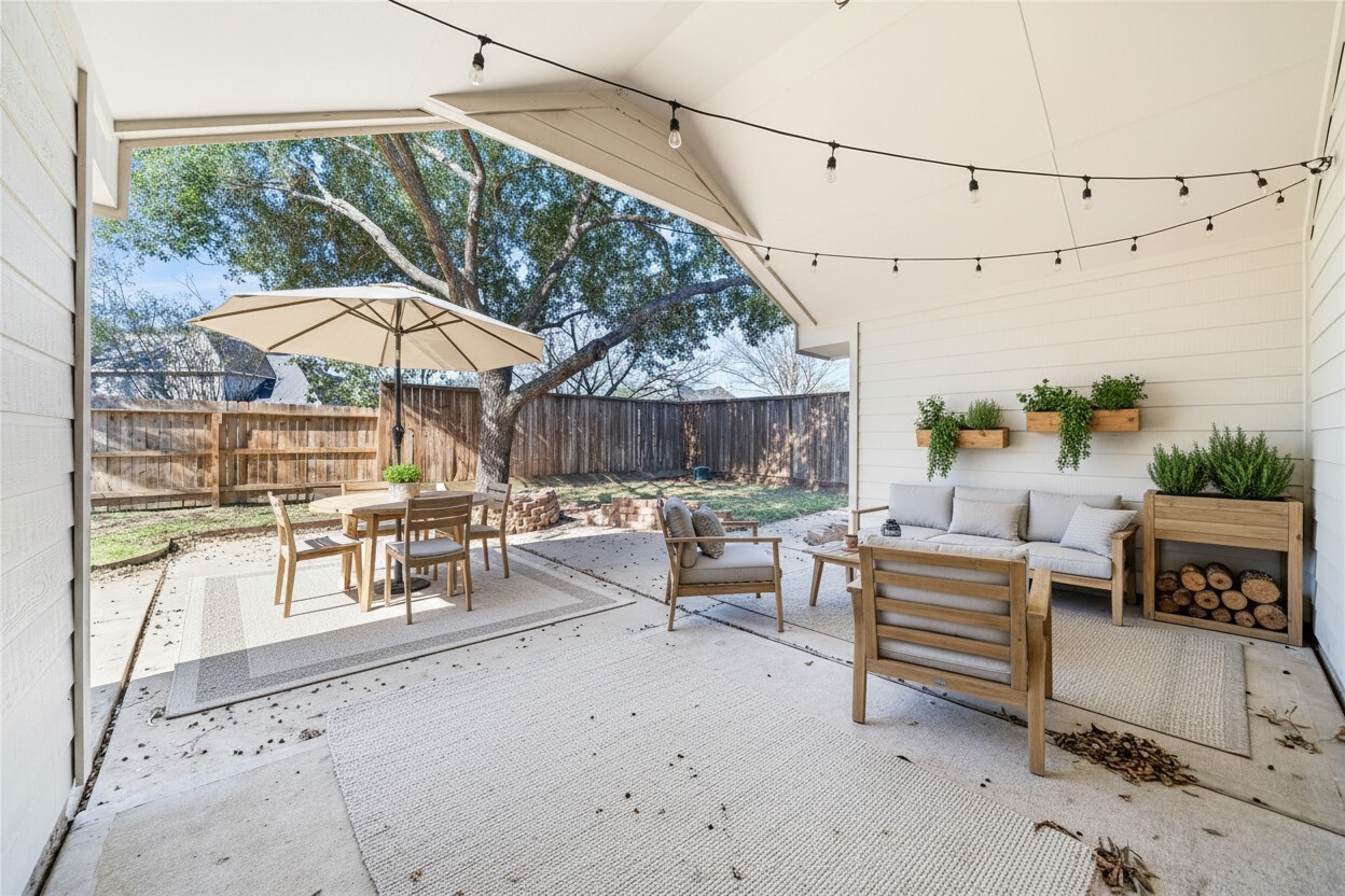 3623 Sage Pointe Court Katy, TX 77449 - Photo 27 of 32 a view of patio with a table and chairs under an umbrella