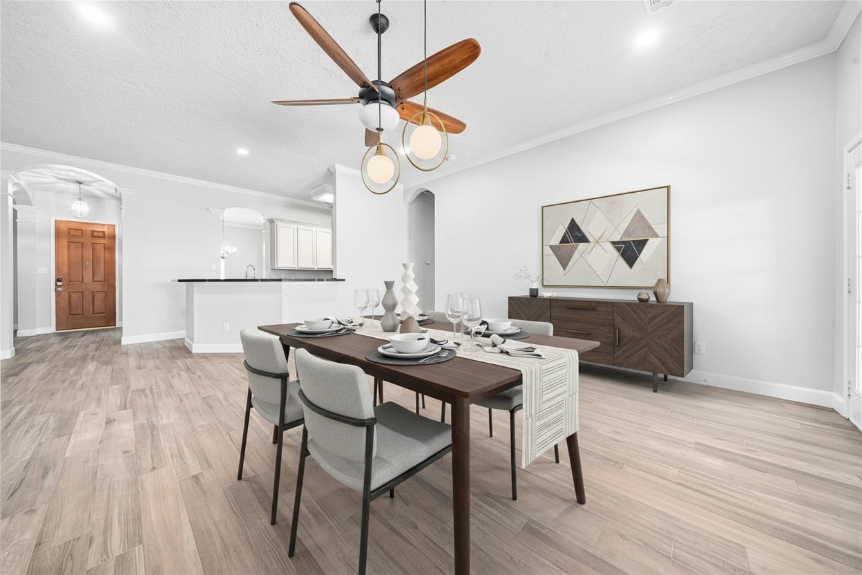 3623 Sage Pointe Court Katy, TX 77449 - Photo 5 of 32 a view of a dining room with furniture and a chandelier