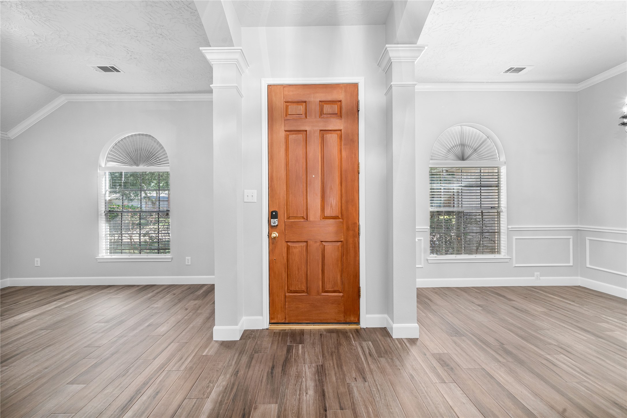 3623 Sage Pointe Court Katy, TX 77449 - Photo 6 of 32 an empty room with wooden floor cabinet and windows