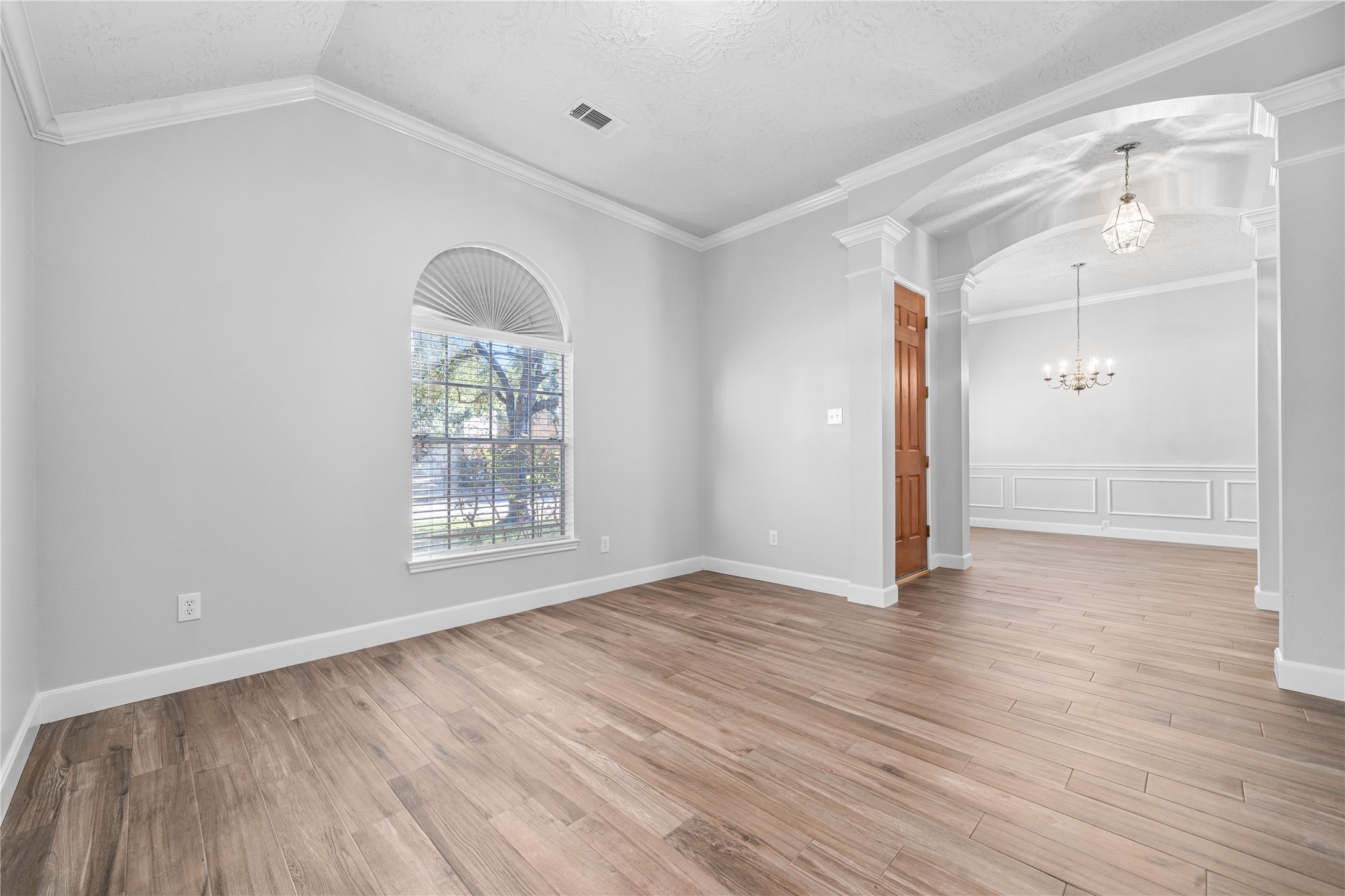 3623 Sage Pointe Court Katy, TX 77449 - Photo 7 of 32 wooden floor in an empty room with a window