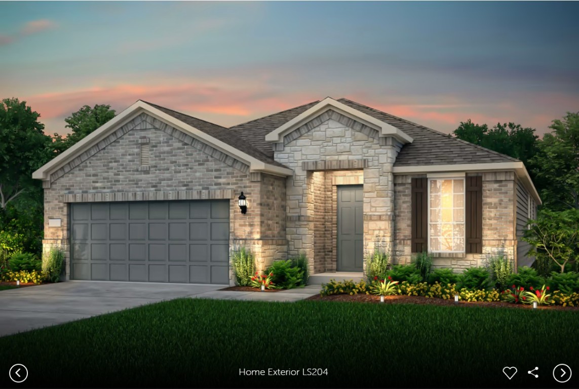 a front view of a house with a garden and plants