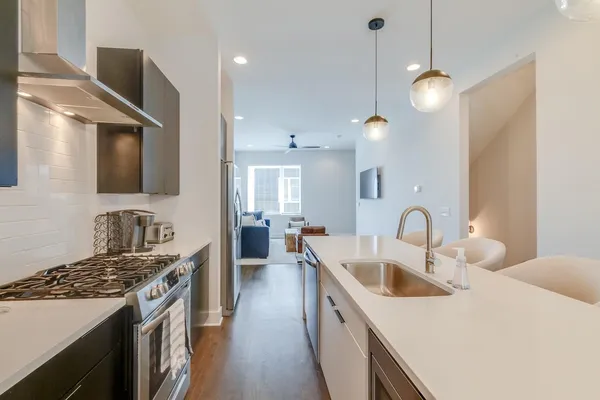 a kitchen that has a sink and a stove