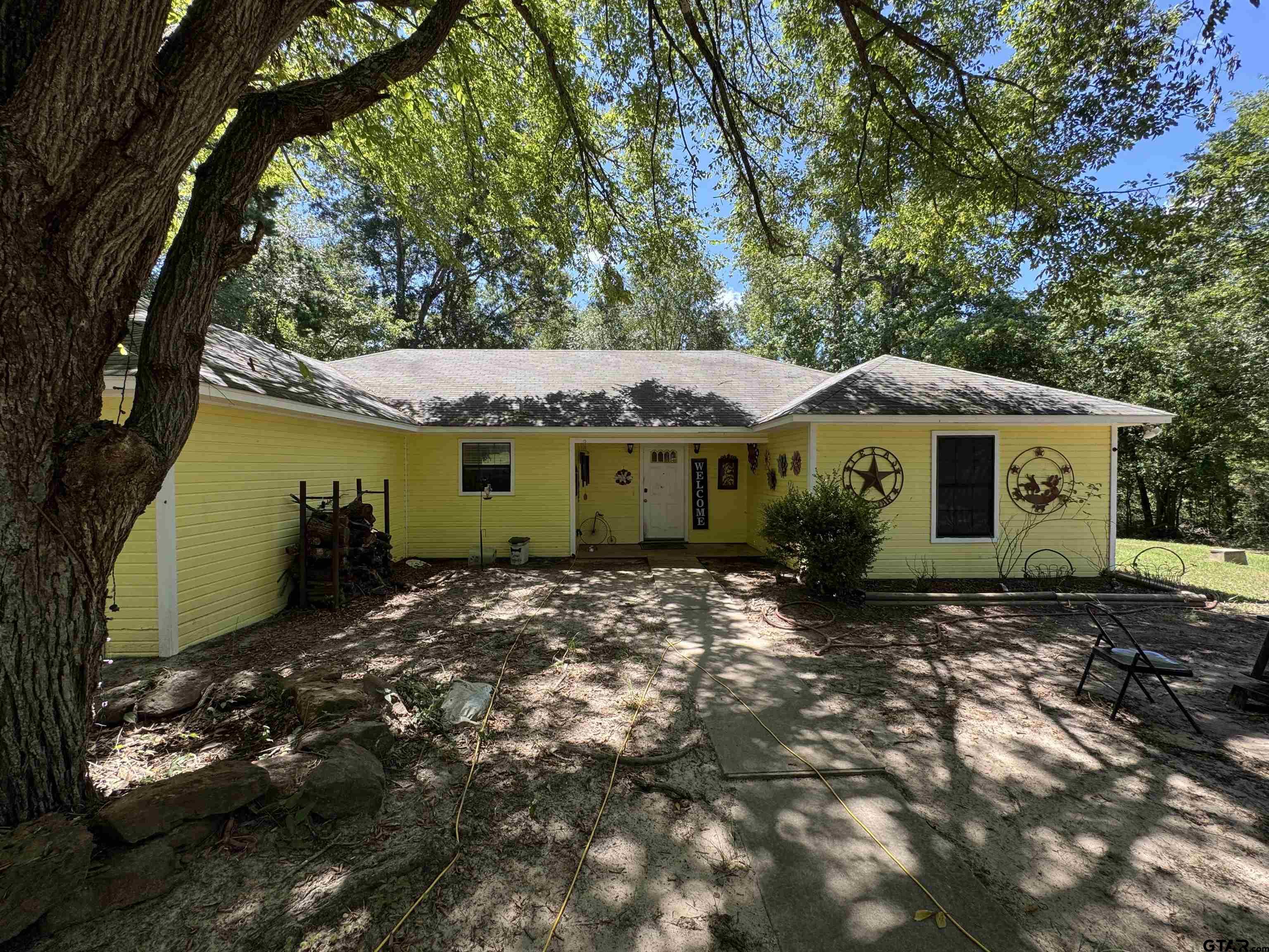 4159 Scrub Pine Road Gilmer, TX 75645 - Photo 14 of 39 a view of a house with a yard