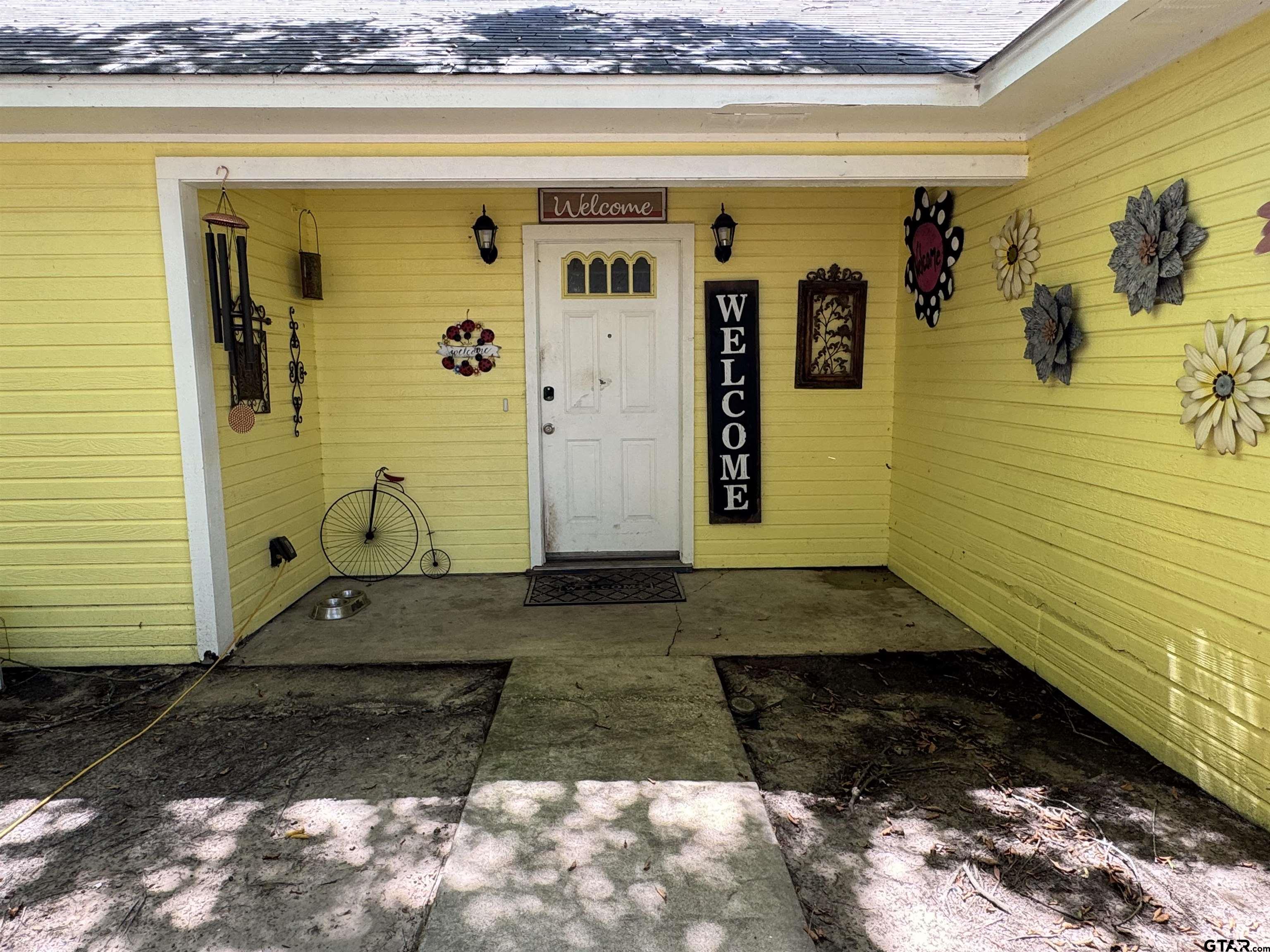 4159 Scrub Pine Road Gilmer, TX 75645 - Photo 15 of 39 a front view of a house with a yard