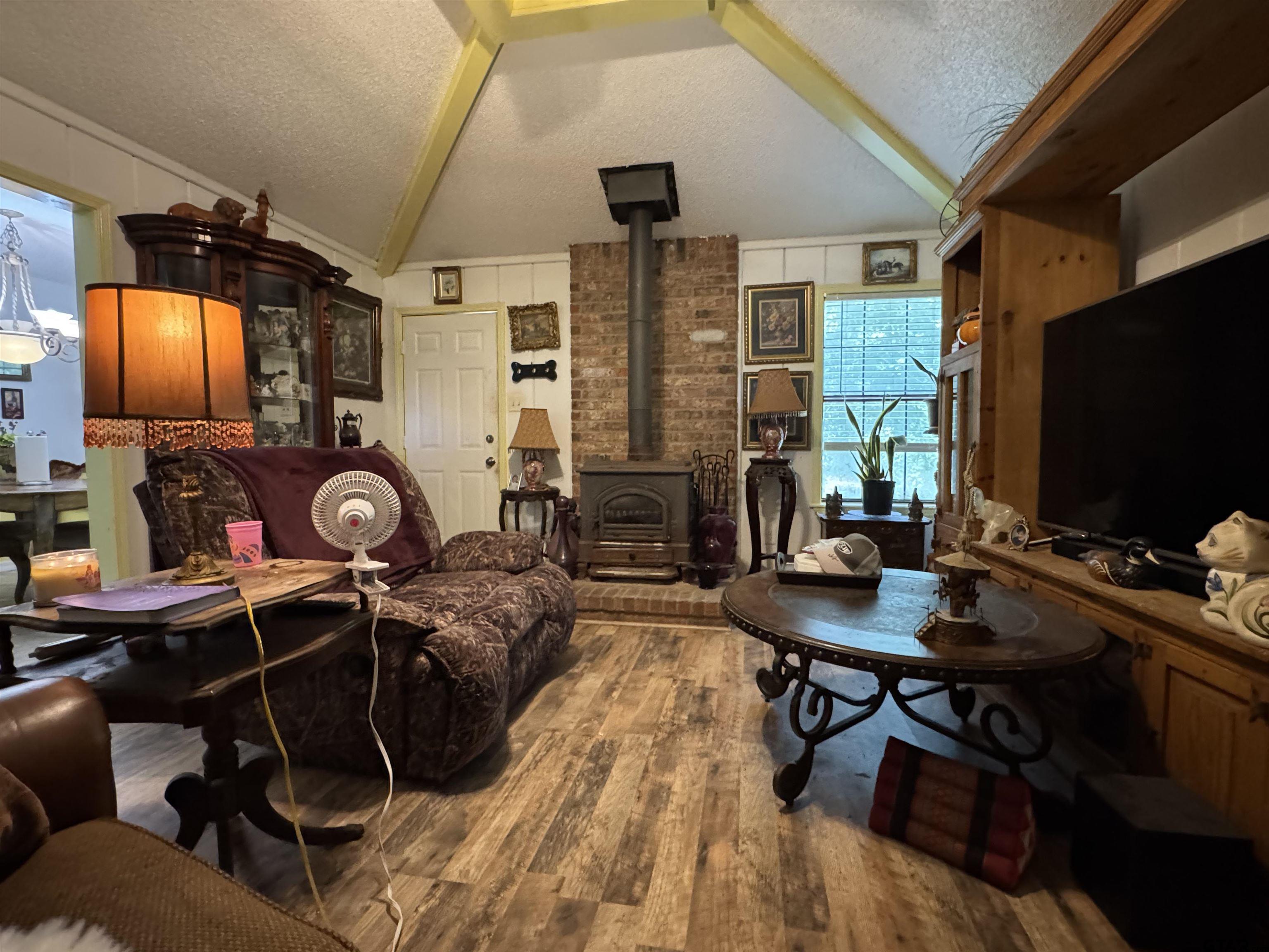4159 Scrub Pine Road Gilmer, TX 75645 - Photo 17 of 39 a work room with furniture and wooden floor