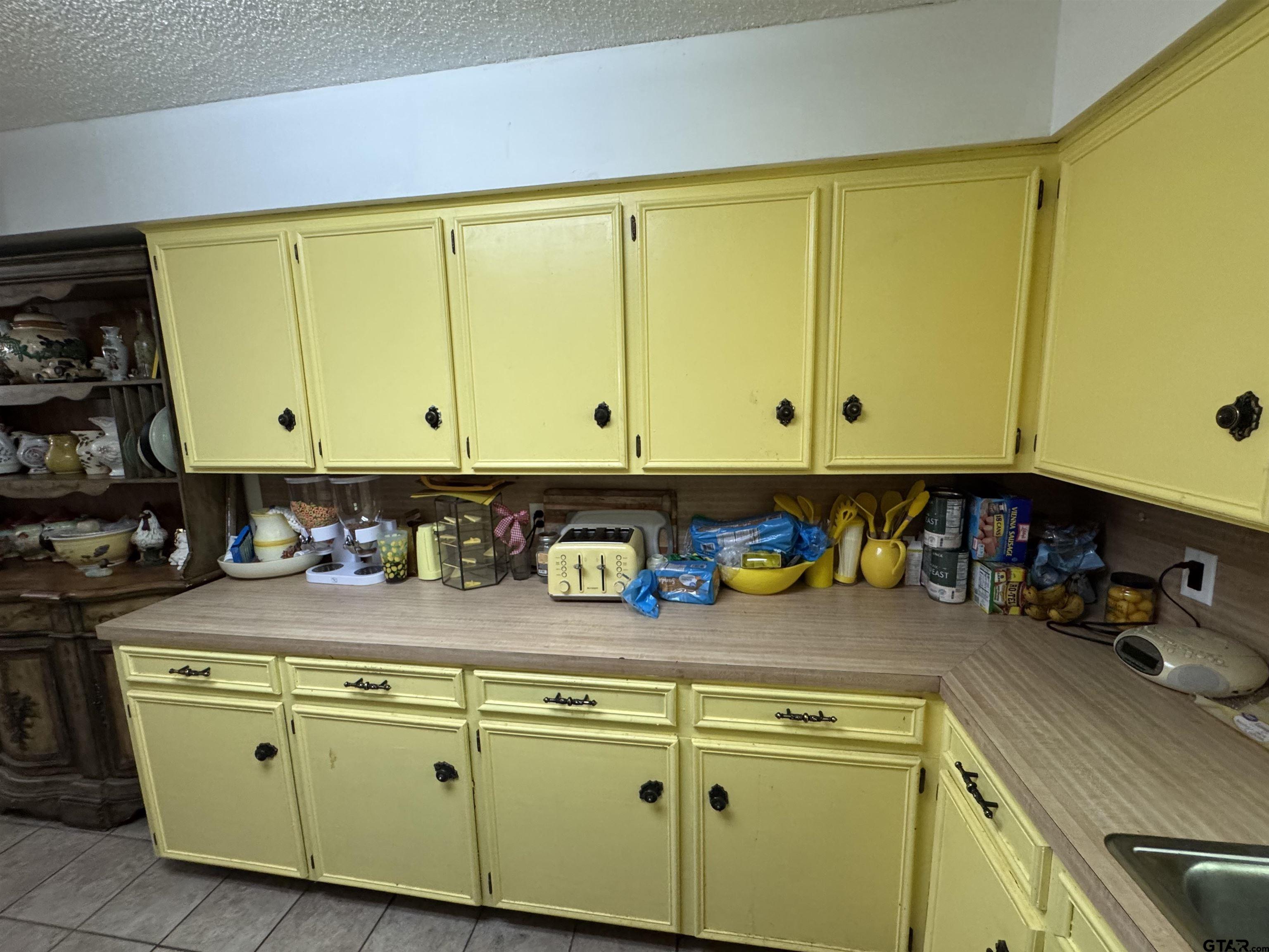4159 Scrub Pine Road Gilmer, TX 75645 - Photo 25 of 39 a kitchen with stainless steel appliances granite countertop a sink and cabinets