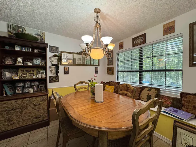 a kitchen with a table and chairs
