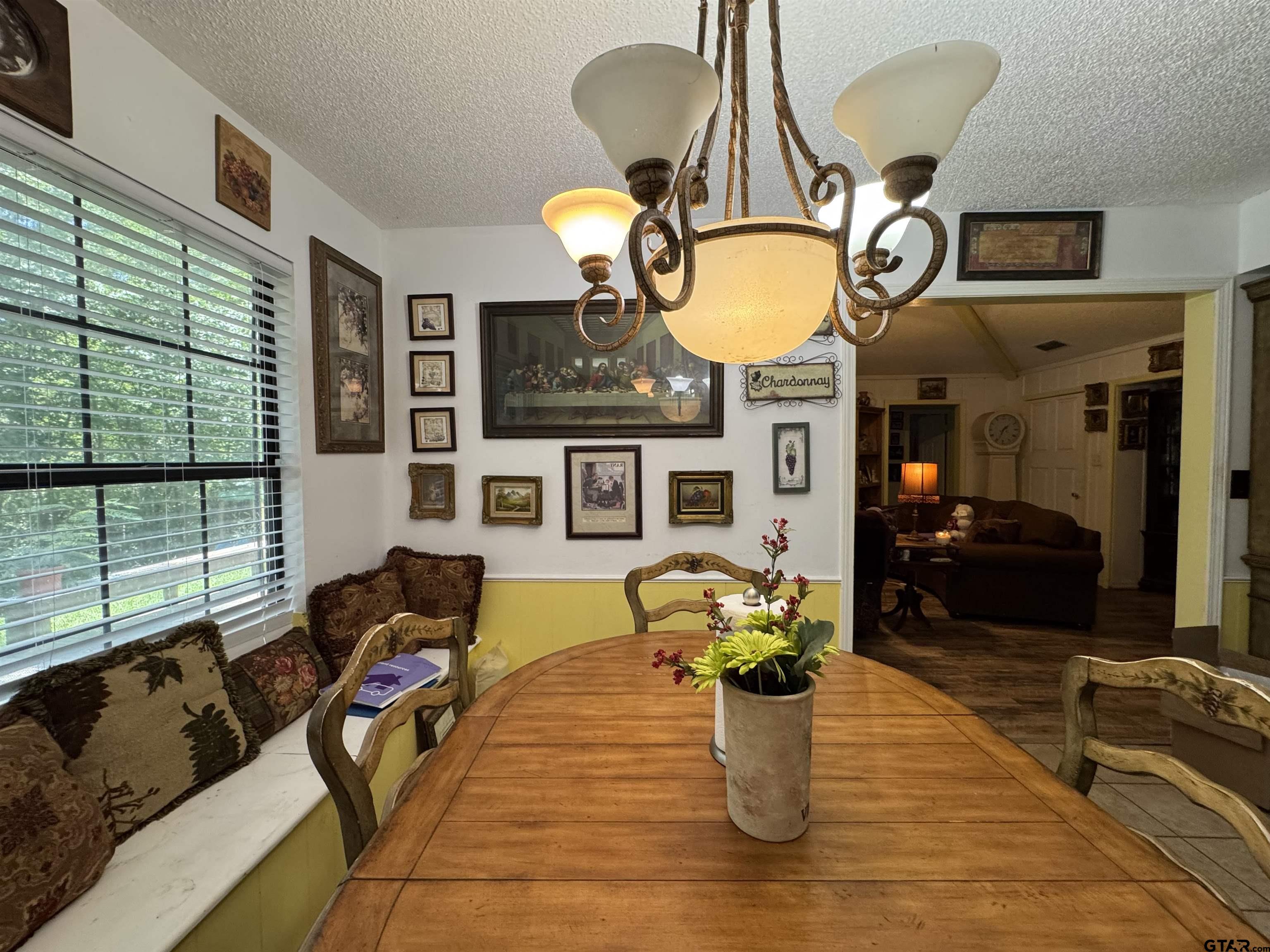 4159 Scrub Pine Road Gilmer, TX 75645 - Photo 29 of 39 a living room filled with furniture and chandelier