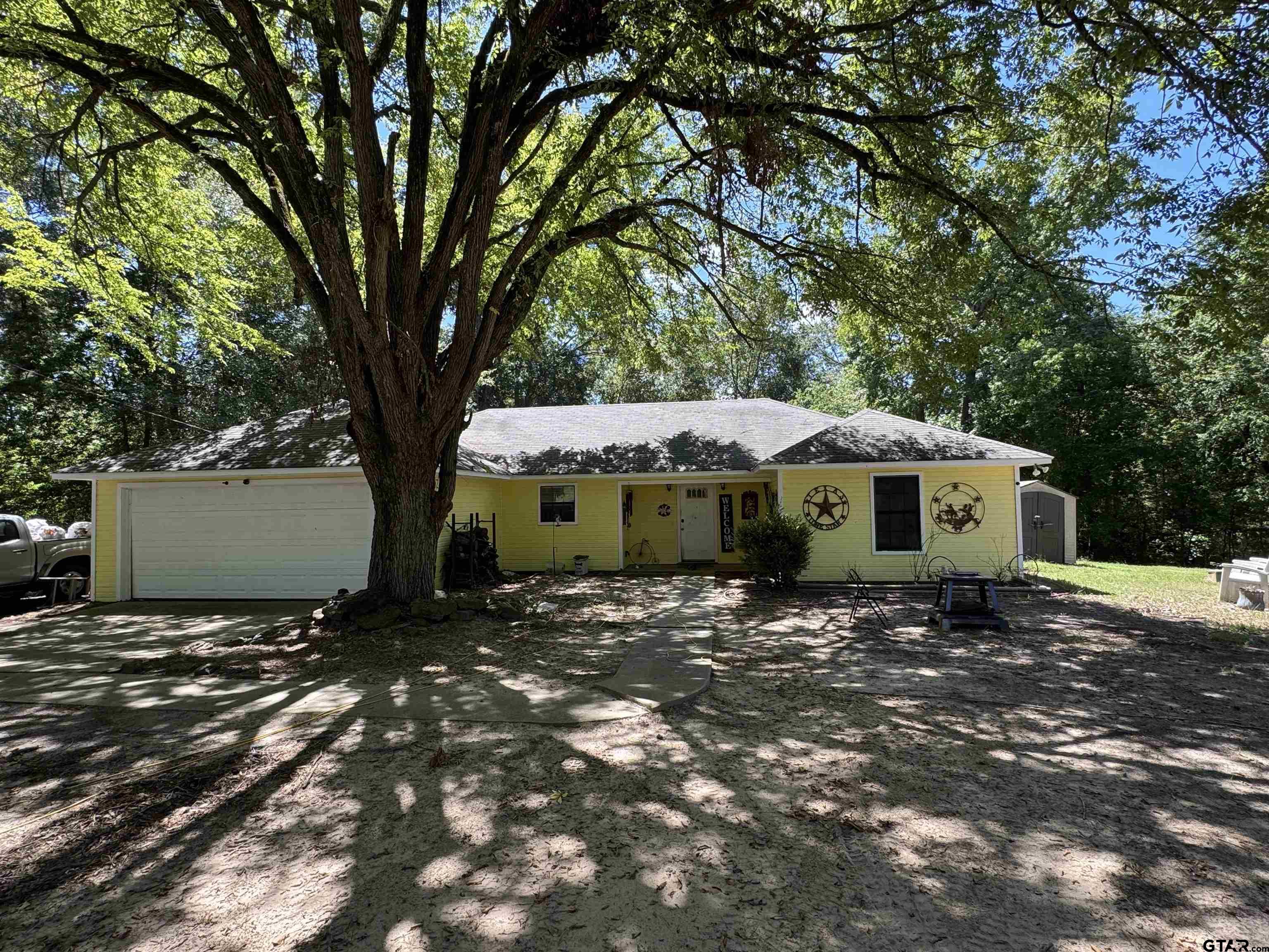 4159 Scrub Pine Road Gilmer, TX 75645 - Photo 5 of 39 a view of a house with a tree