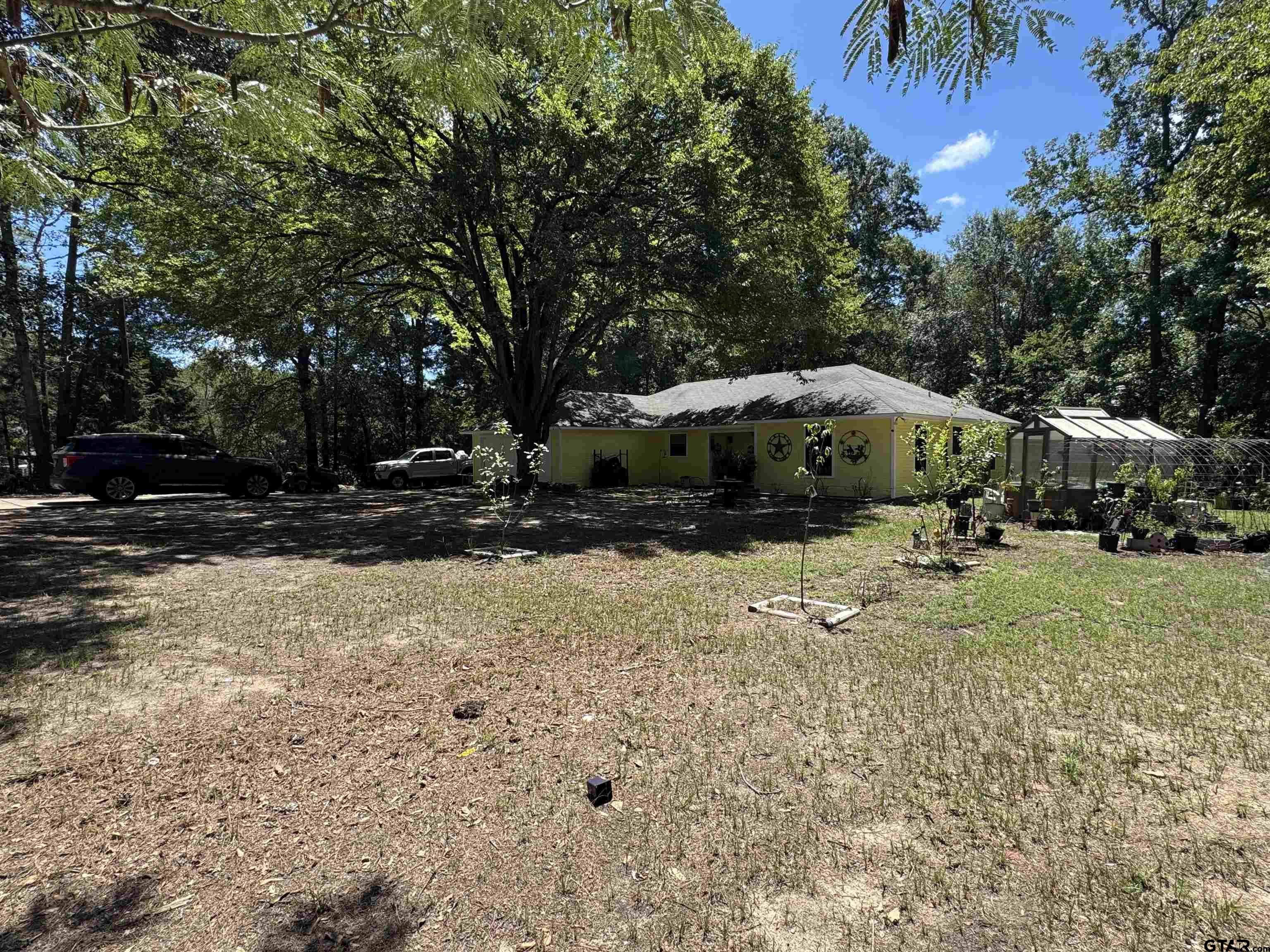 4159 Scrub Pine Road Gilmer, TX 75645 - Photo 7 of 39 a view of swimming pool and trees in the background