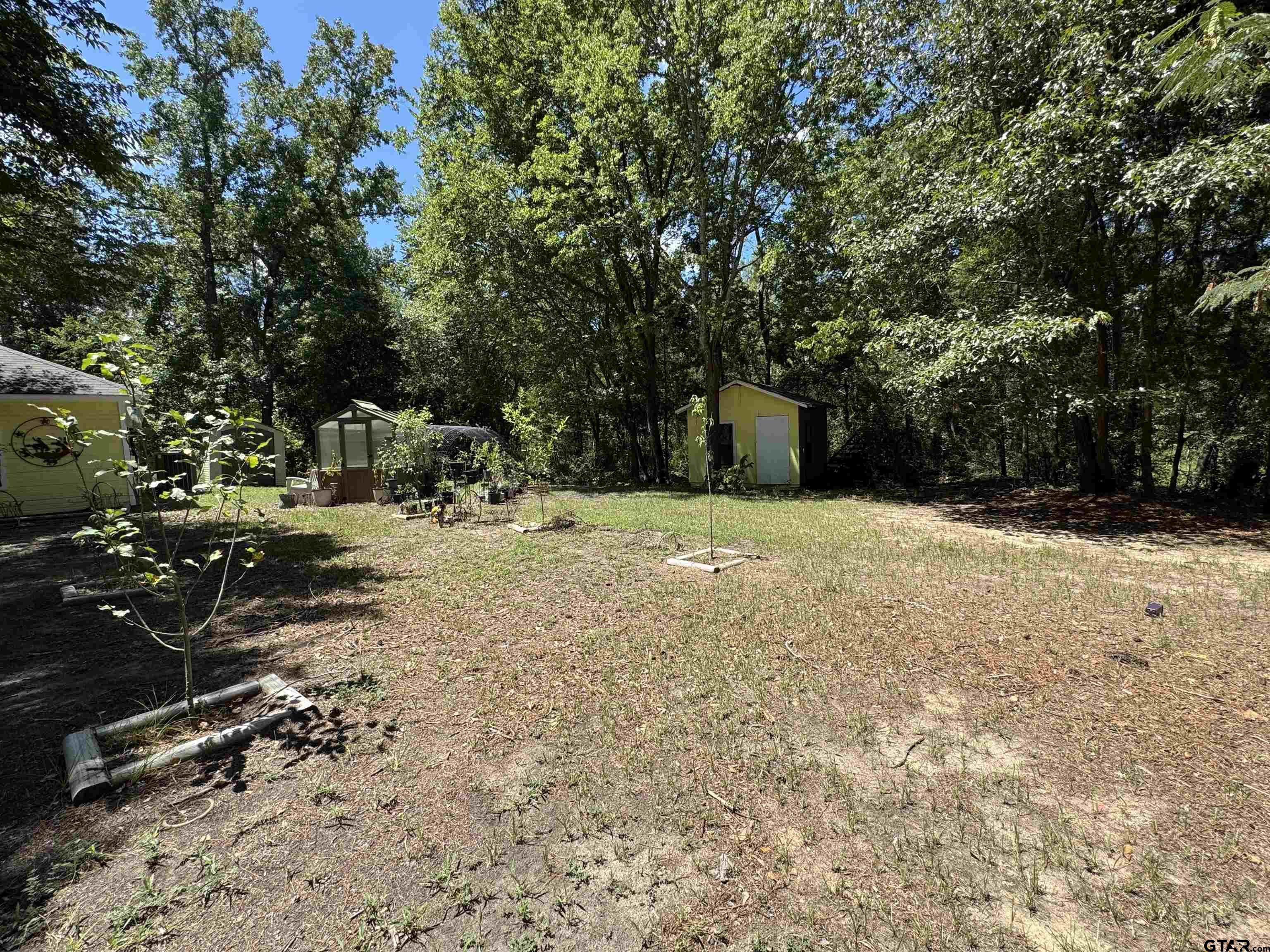 4159 Scrub Pine Road Gilmer, TX 75645 - Photo 10 of 39 a view of outdoor space with deck and yard