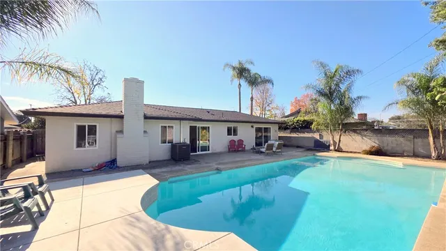 a house view with a sitting space and garden