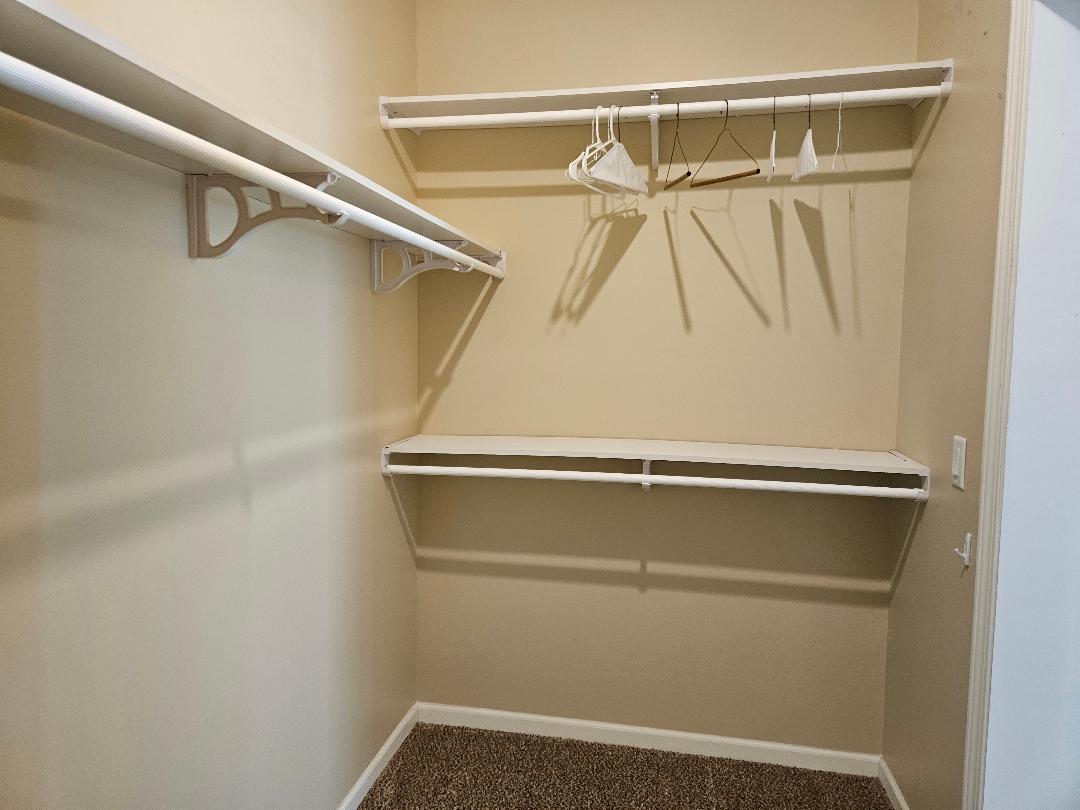 555 Paint Creek Road, Unit C McDade, TX 78650 - Photo 12 of 26 a view of a room with racks on the wall