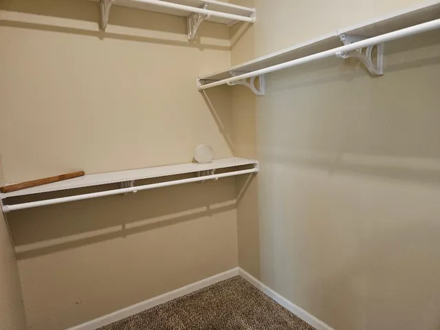 a view of a room with racks on the wall