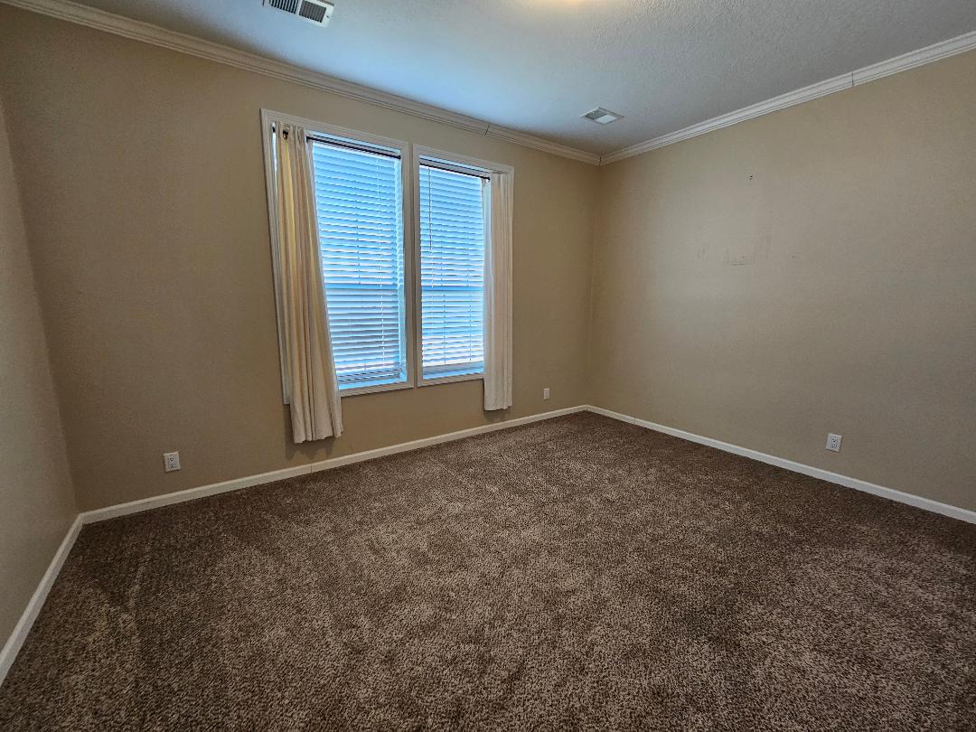 555 Paint Creek Road, Unit C McDade, TX 78650 - Photo 15 of 26 an empty room with a window
