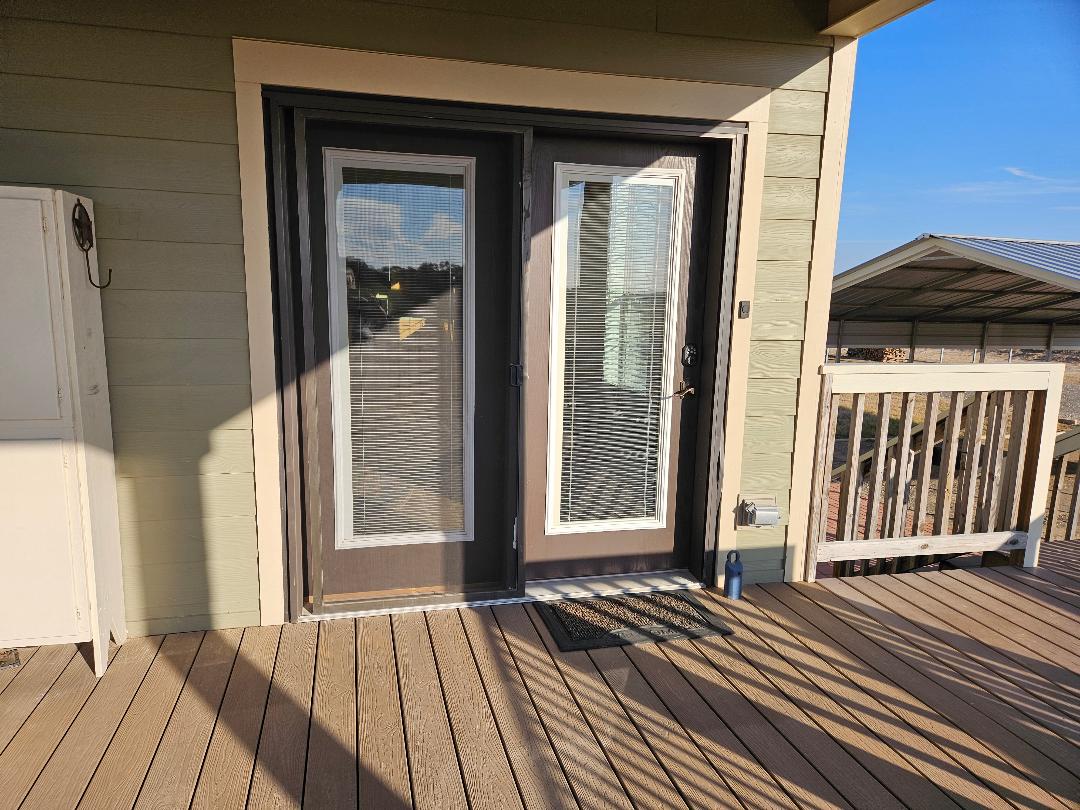 555 Paint Creek Road, Unit C McDade, TX 78650 - Photo 19 of 26 a view of a balcony with wooden floor