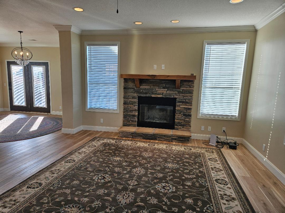 555 Paint Creek Road, Unit C McDade, TX 78650 - Photo 3 of 26 a view of empty room with wooden floor and fireplace